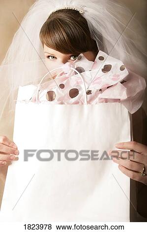 Stock Photo - Bride and wedding present. Fotosearch