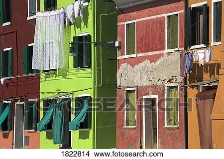 Picture - Brightly painted houses and washing, Burano, Italy . Fotosearch