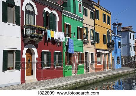 Brightly painted houses with hanging laundry, Burano, Italy View Large Photo Image Stock Photo - Brightly painted houses with hanging laundry, Burano, Italy . Fotosearch