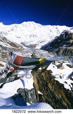 Stock Image - Buddhist prayer flags at Annapurna Sanctuary, Nepal. Fotosearch