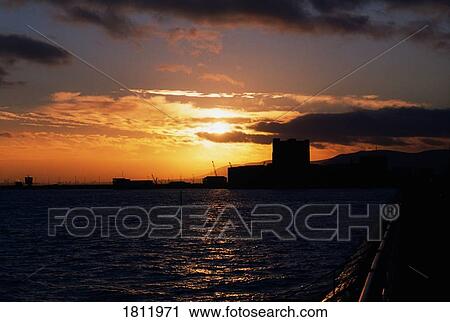 Castle and harbour at sunset, Carrickfergus, Co Antrim, Ireland View Large Photo Image Stock Image - Castle and harbour at sunset, Carrickfergus, Co Antrim, Ireland. Fotosearch