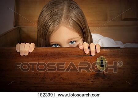 Child hiding inside old trunk with key hole View Large Photo Image Stock Image - Child hiding inside old trunk with key hole . Fotosearch