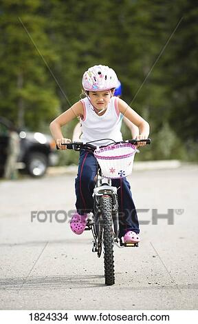 Child riding a bicycle View Large Photo Image Picture - Child riding a bicycle . Fotosearch