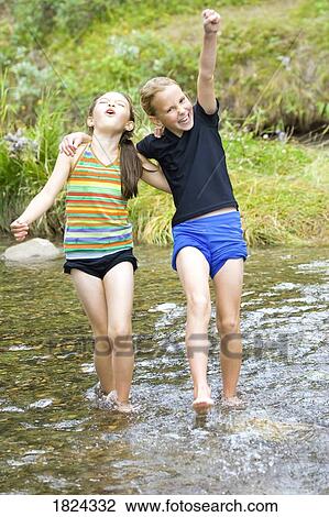 Children playing in stream View Large Photo Image Stock Image - Children playing in stream . Fotosearch
