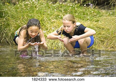 Children playing in stream View Large Photo Image Stock Image - Children playing in stream . Fotosearch