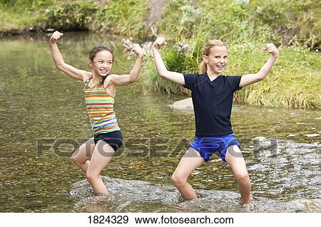 Children playing in stream View Large Photo Image Stock Photo - Children playing in stream . Fotosearch