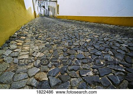 Cobblestone street, Evora, Portugal View Large Photo Image Stock Photograph - Cobblestone street, Evora, Portugal. Fotosearch