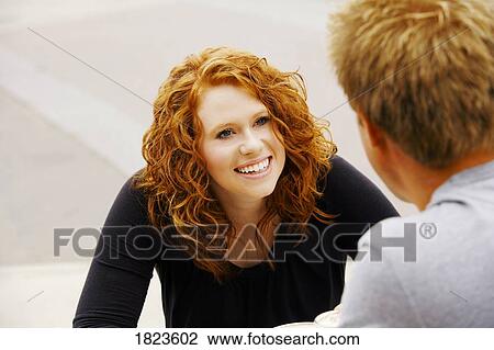 Couple smiling at each other View Large Photo Image Stock Image - Couple smiling at each other. Fotosearch
