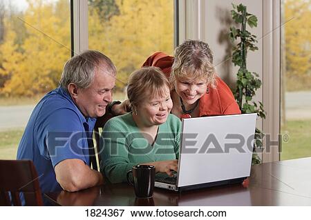 Family on laptop computer View Large Photo Image Stock Photo - Family on laptop computer. Fotosearch