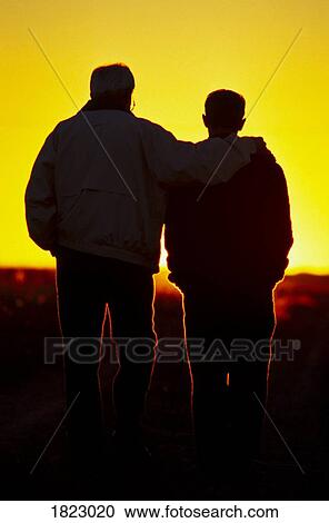 Stock Image - Father and son silhouette. Fotosearch