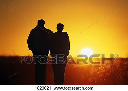 Stock Image - Father and son silhouette. Fotosearch