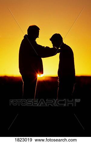 Father with hands on his son View Large Photo Image Stock Photo - Father with hands on his son. Fotosearch