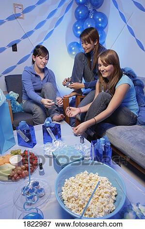 Girlfriends having a party View Large Photo Image Stock Photo - Girlfriends having a party. Fotosearch