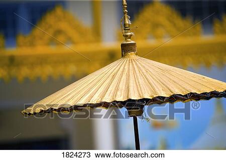 Gold, Asian umbrellas View Large Photo Image Stock Image - Gold, Asian umbrellas. Fotosearch