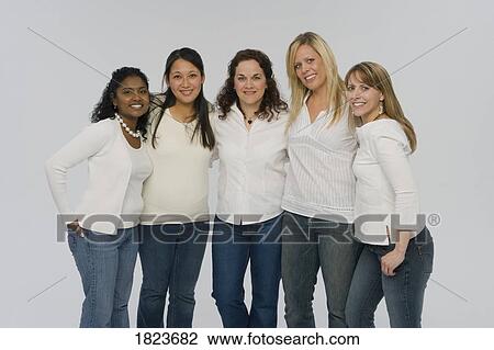 Stock Image - Group of women wearing matching outfits. Fotosearch