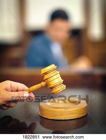 Hand holding a gavel View Large Photo Image Stock Image - Hand holding a gavel. Fotosearch