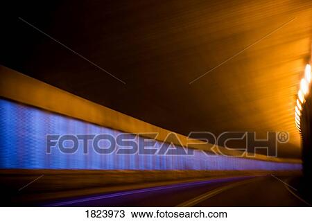 Stock Image - Highway through tunnel, Alberta, Canada. Fotosearch