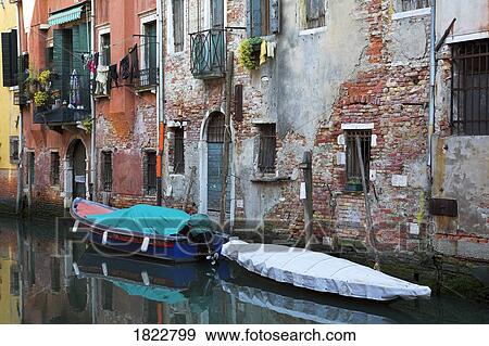 Stock Photo - Housing along a canal, Venice, Italy. Fotosearch