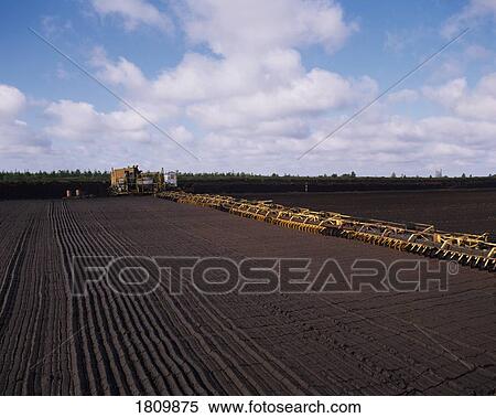 Stock Photography - Industrial turf production, Ireland. Fotosearch