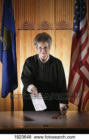 Stock Photo - Judge handing out a judgement. Fotosearch