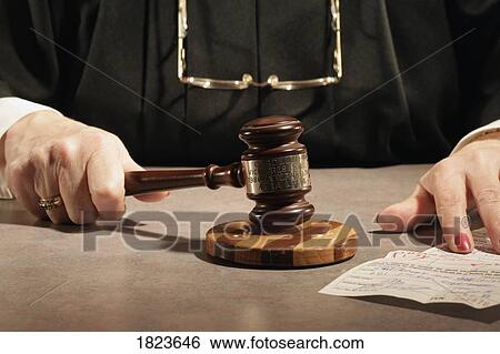 Stock Photograph - Judge using a gavel. Fotosearch