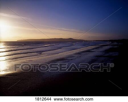 Malahide Beach and Howth Head at sunrise, Co Dublin, Ireland View Large Photo Image Picture - Malahide Beach and Howth Head at sunrise, Co Dublin, Ireland. Fotosearch