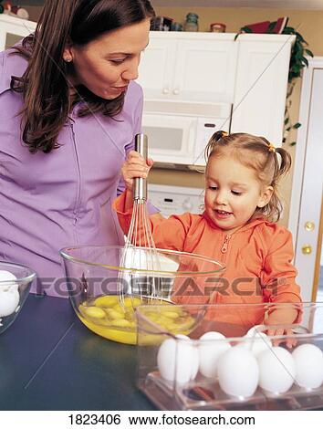 Mother and daughter cooking View Large Photo Image Stock Photograph - Mother and daughter cooking. Fotosearch