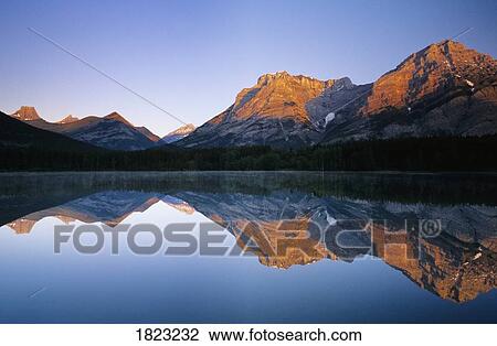 Mount Kidd reflected in Wedge Pond, Kananaskis Country, Alberta, Canada View Large Photo Image Stock Image - Mount Kidd reflected in Wedge Pond, Kananaskis Country, Alberta, Canada. Fotosearch