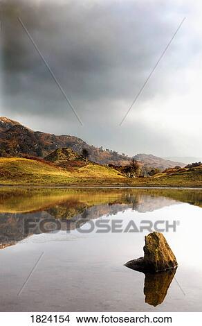 Mountain reflection, Loch Lobhair, Scotland View Large Photo Image Picture - Mountain reflection, Loch Lobhair, Scotland. Fotosearch