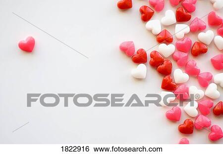 One candy heart separated from the others View Large Photo Image Stock Photograph - One candy heart separated from the others. Fotosearch