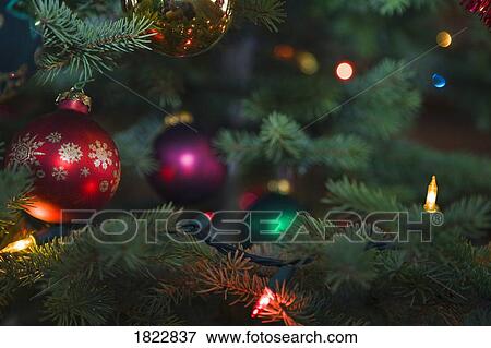 Stock Photo - Ornaments on a Christmas tree. Fotosearch