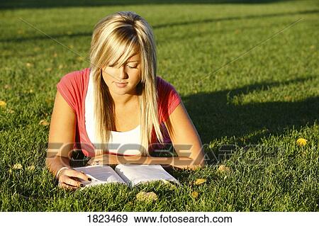 Stock Photo - Portrait of a woman reading her Bible. Fotosearch