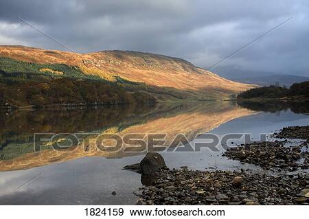 Stock Photo - Reflection in the water, Loch Lobhair, Scotland. Fotosearch