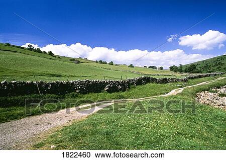 Stock Image - Road and stone fences, Yorkshire Dales National Park, England. Fotosearch