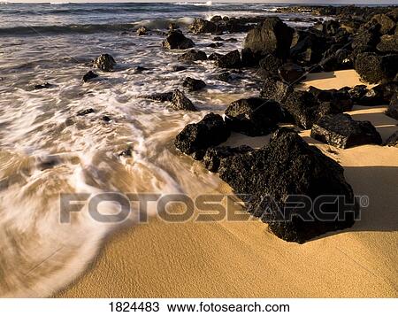 Rocks on the beach, Poipu, Kauai, Hawaii View Large Photo Image Stock Image - Rocks on the beach, Poipu, Kauai, Hawaii. Fotosearch