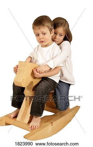 Sad children on a rocking horse View Large Photo Image Stock Image - Sad children on a rocking horse . Fotosearch