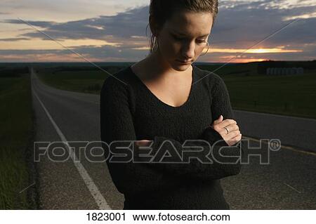 Sad woman beside the road View Large Photo Image Stock Image - Sad woman beside the road. Fotosearch