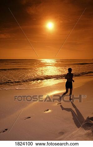 Silhouette of a female jogger along the ocean View Large Photo Image Stock Image - Silhouette of a female jogger along the ocean. Fotosearch
