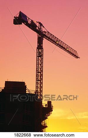 Silhouette of construction crane View Large Photo Image Stock Photo - Silhouette of construction crane. Fotosearch