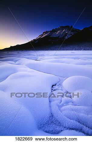 Snow and mountains at dawn, Banff National Park, Alberta, Canada View Large Photo Image Stock Photo - Snow and mountains at dawn, Banff National Park, Alberta, Canada. Fotosearch
