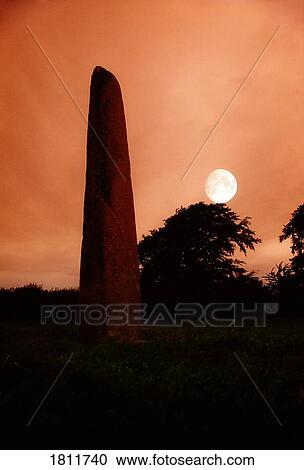 Standing stone with moon, Punchestown, Co Kildare, Ireland View Large Photo Image Stock Image - Standing stone with moon, Punchestown, Co Kildare, Ireland. Fotosearch