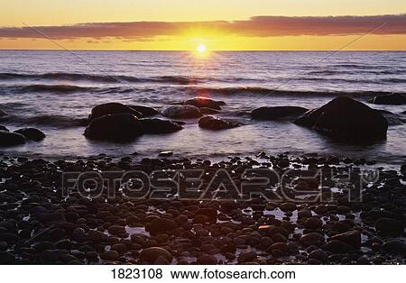 Sunset over water, Newfoundland, Canada View Large Photo Image Stock Photo - Sunset over water, Newfoundland, Canada. Fotosearch