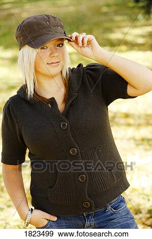 Teenage girl in baseball cap View Large Photo Image Stock Photo - Teenage girl in baseball cap. Fotosearch