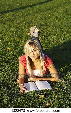 Stock Photo - Teenager reading a book. Fotosearch