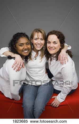 Stock Photography - Three girlfriends. Fotosearch