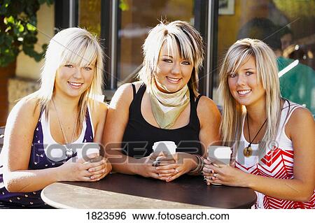 Three women sitting together View Large Photo Image Stock Photograph - Three women sitting together. Fotosearch