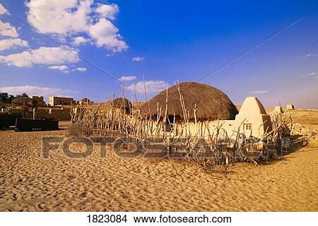 Traditional Rajasthani village with mud houses near Jaisalmer View Large Photo Image Picture - Traditional Rajasthani village with mud houses near Jaisalmer . Fotosearch