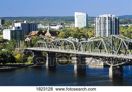 View of Hull and the Alexandra Bridge spanning the Ottawa River, Ottawa, Ontario, Canada View Large Photo Image Stock Photo - View of Hull and the Alexandra Bridge spanning the Ottawa River, Ottawa, Ontario, Canada. Fotosearch