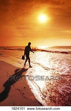 Walking along the beach View Large Photo Image Stock Image - Walking along the beach. Fotosearch