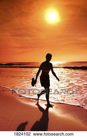 Walking along the beach View Large Photo Image Stock Image - Walking along the beach. Fotosearch
